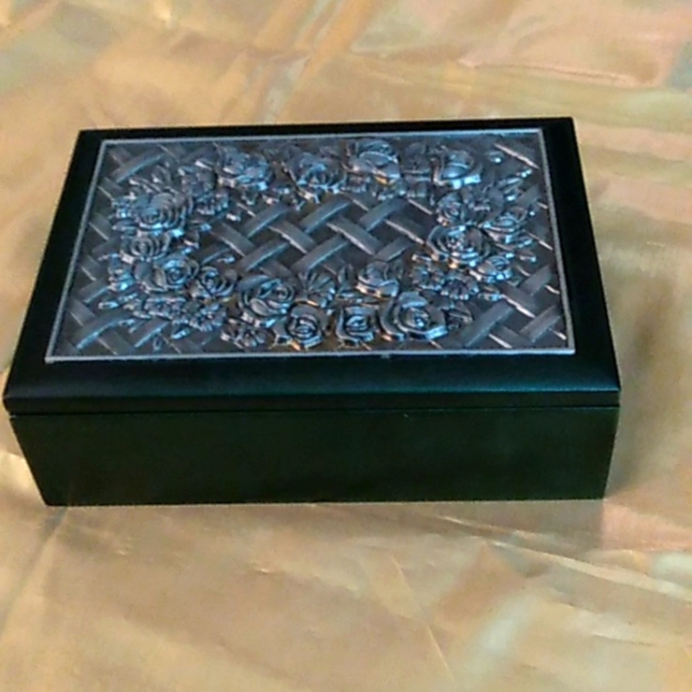 Black wood jewelry box with pewter lattice and rose top.